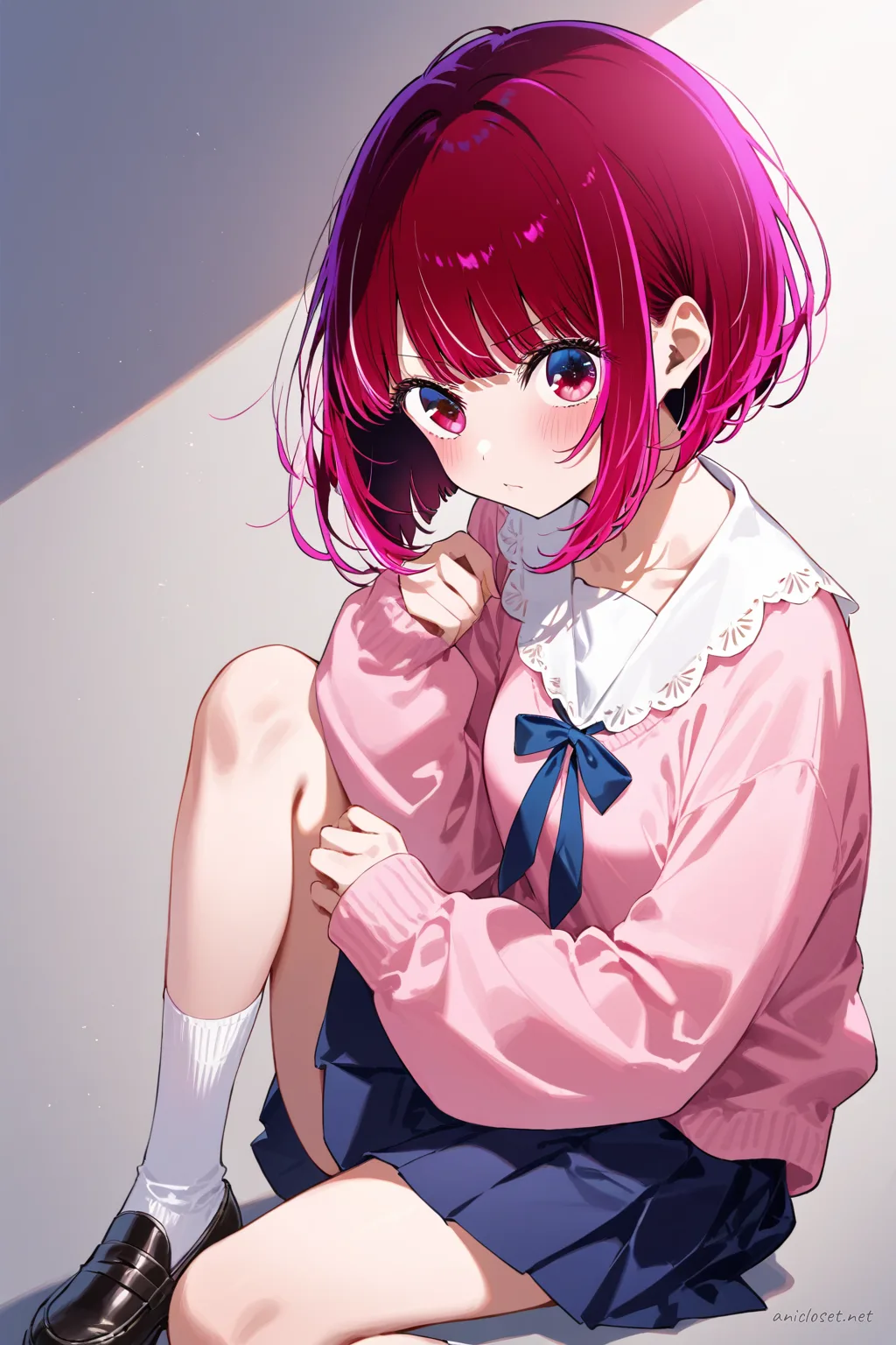 Full-body illustration of Kana Arima in a pastel pink cardigan over navy jumper skirt, white blouse with peter pan collar, black knee socks, and black loafers, standing against a clean studio background